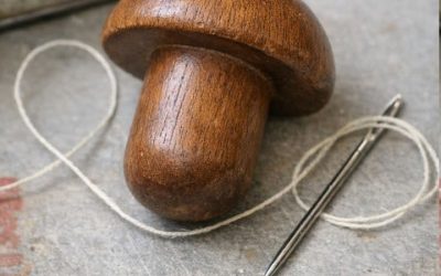 Found this smooth wooden object in an old sewing tin. Shaped like a mushroom but the handle is too short to be a pestle.