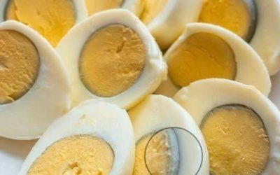 Why does a green ring appear around hard-boiled eggs?