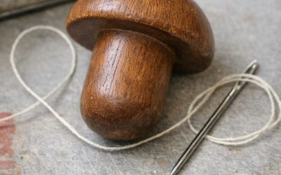 Found this smooth wooden object in an old sewing tin. Shaped like a mushroom but the handle is too short to be a pestle.